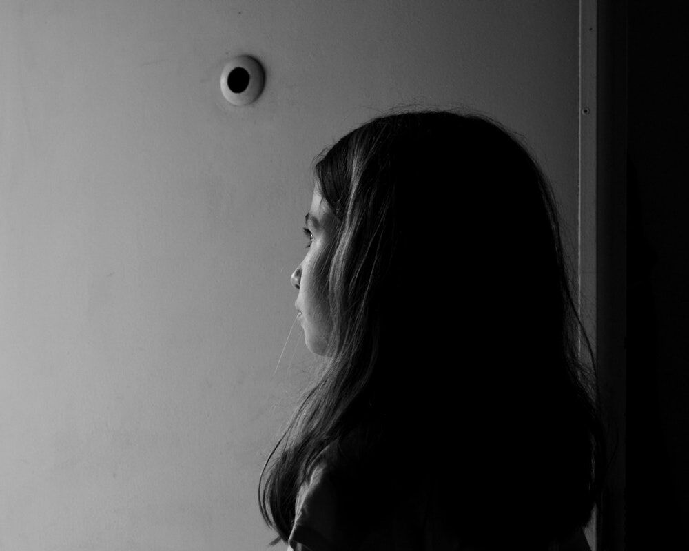 Sad girl alone in black and white photo