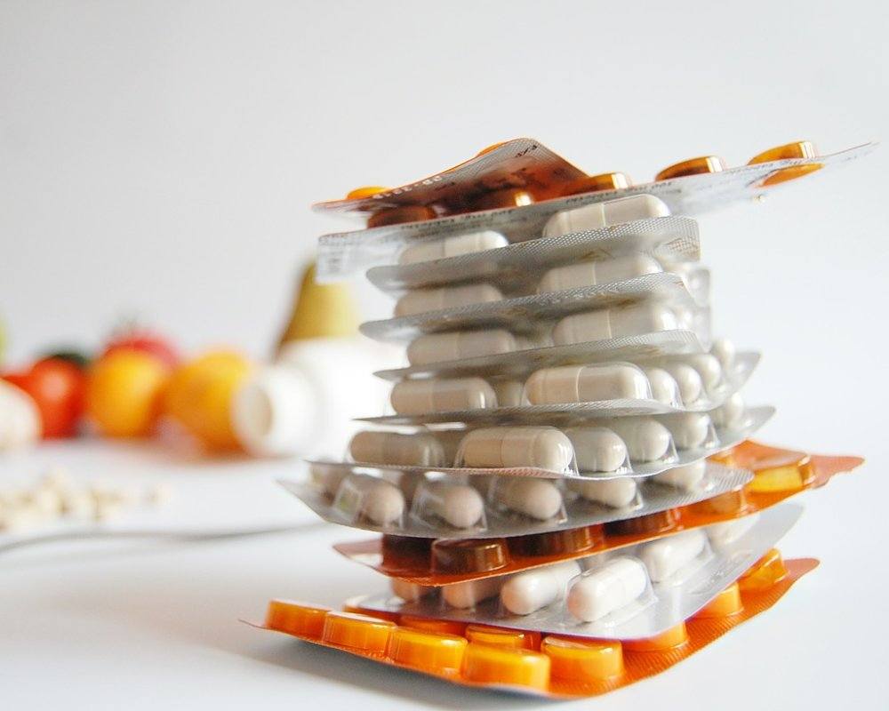 Pile of pills and supplements in plastic packaging
